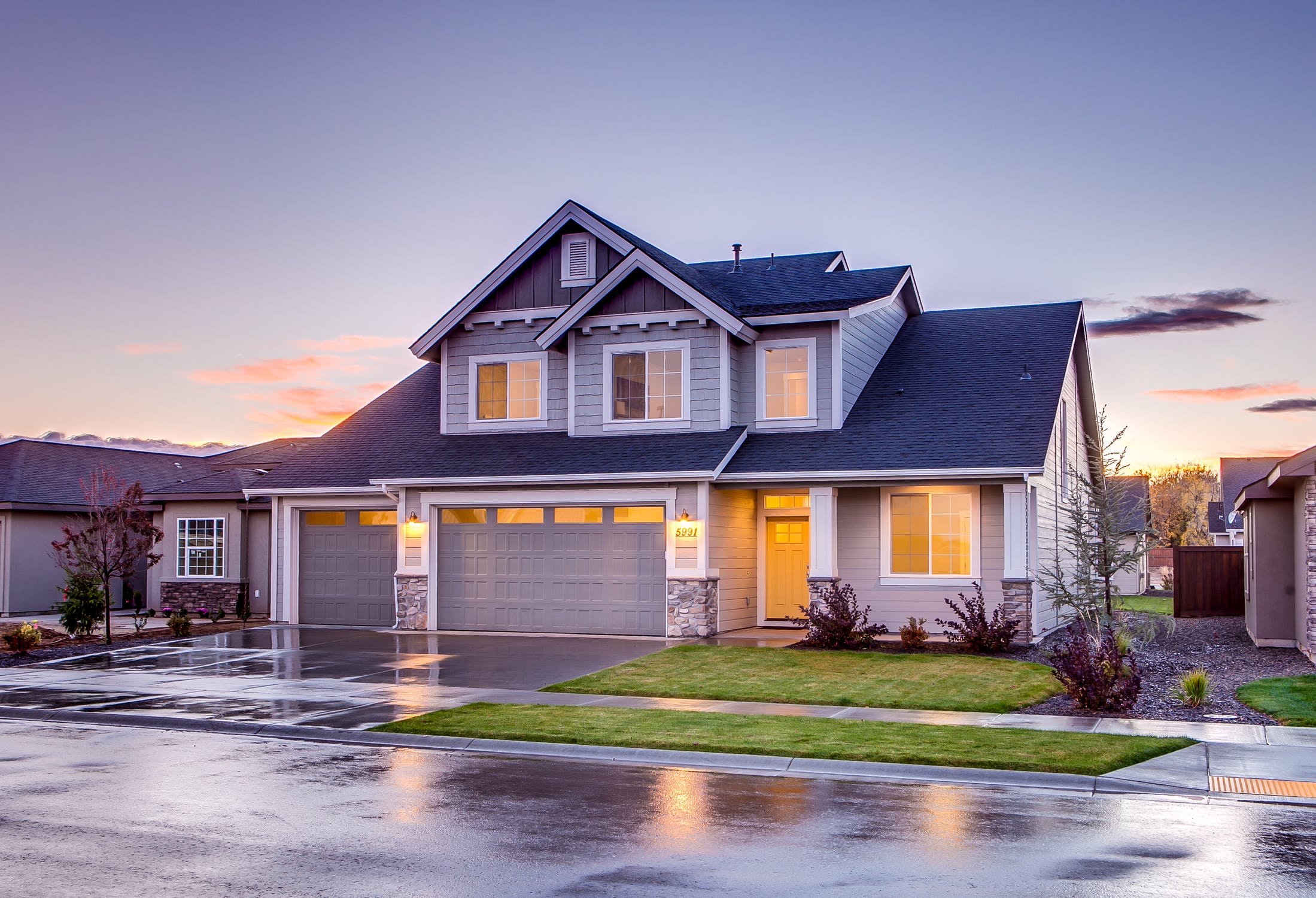 Freshly paved residential driveway with curb appeal enhancement